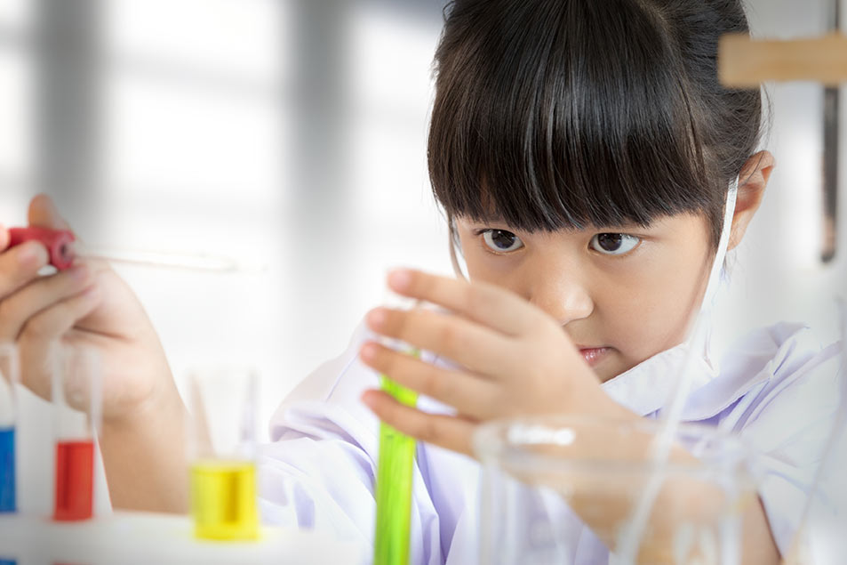 girl with science toys